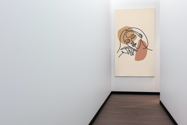 Canvas print of drawing of a person on a wall.
